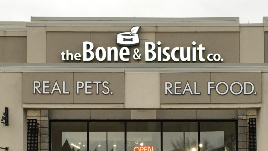 The exterior storefront of the the Bone & Biscuit Magrath, a pet store in Edmonton, Alberta
