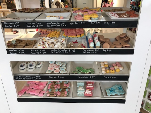 The inside dog bakery shelves with dog cookie and treats in the Edmonton pet store Bone & Biscuit Magrath.