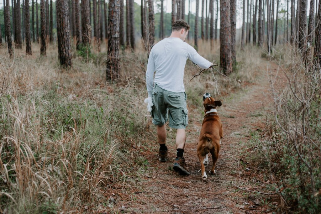 Man with dog on trail 