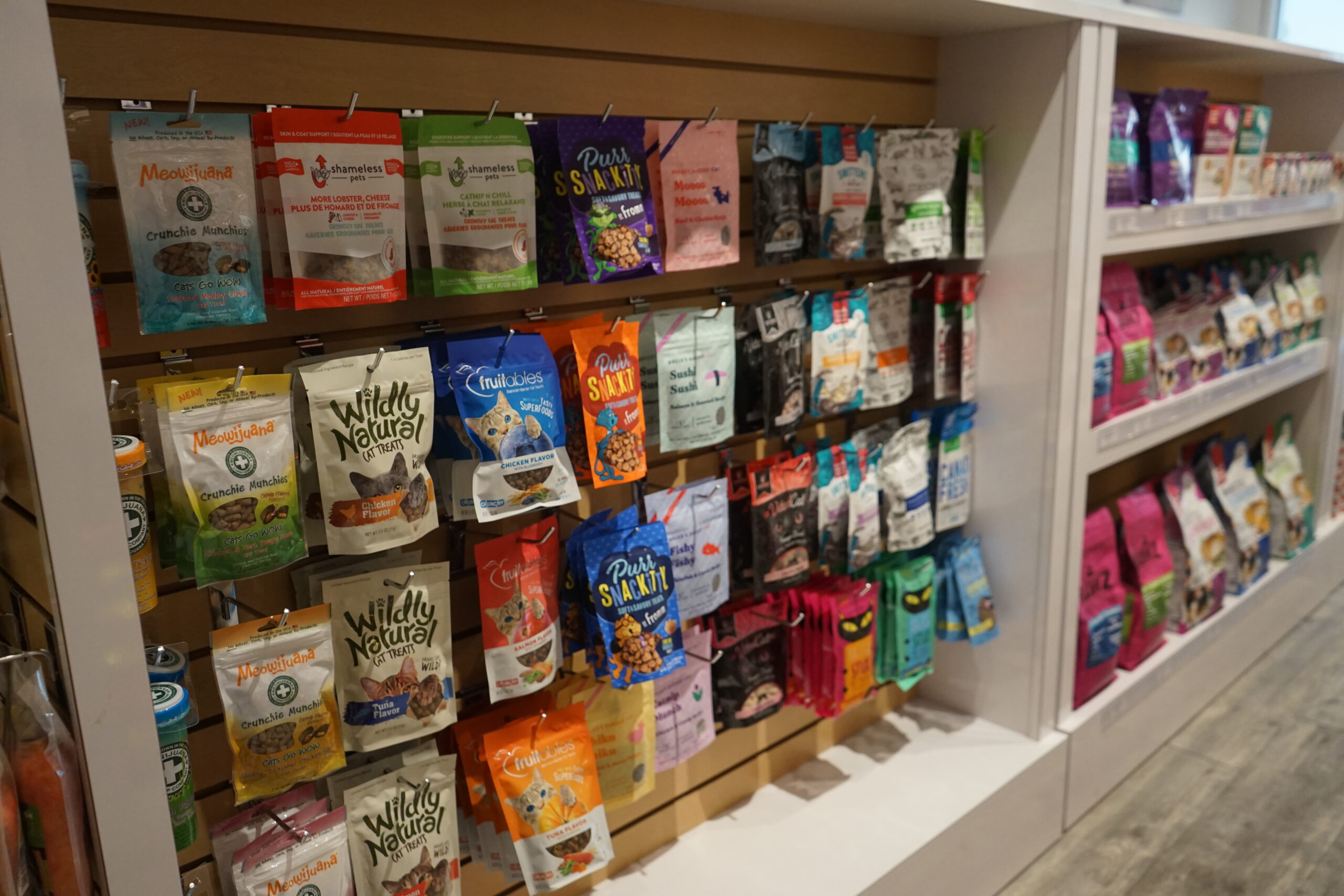 The pet treats display shelfs of pet treats at Bone & Biscuit Okotoks, a pet supply store in Okotoks Alberta with new owners.