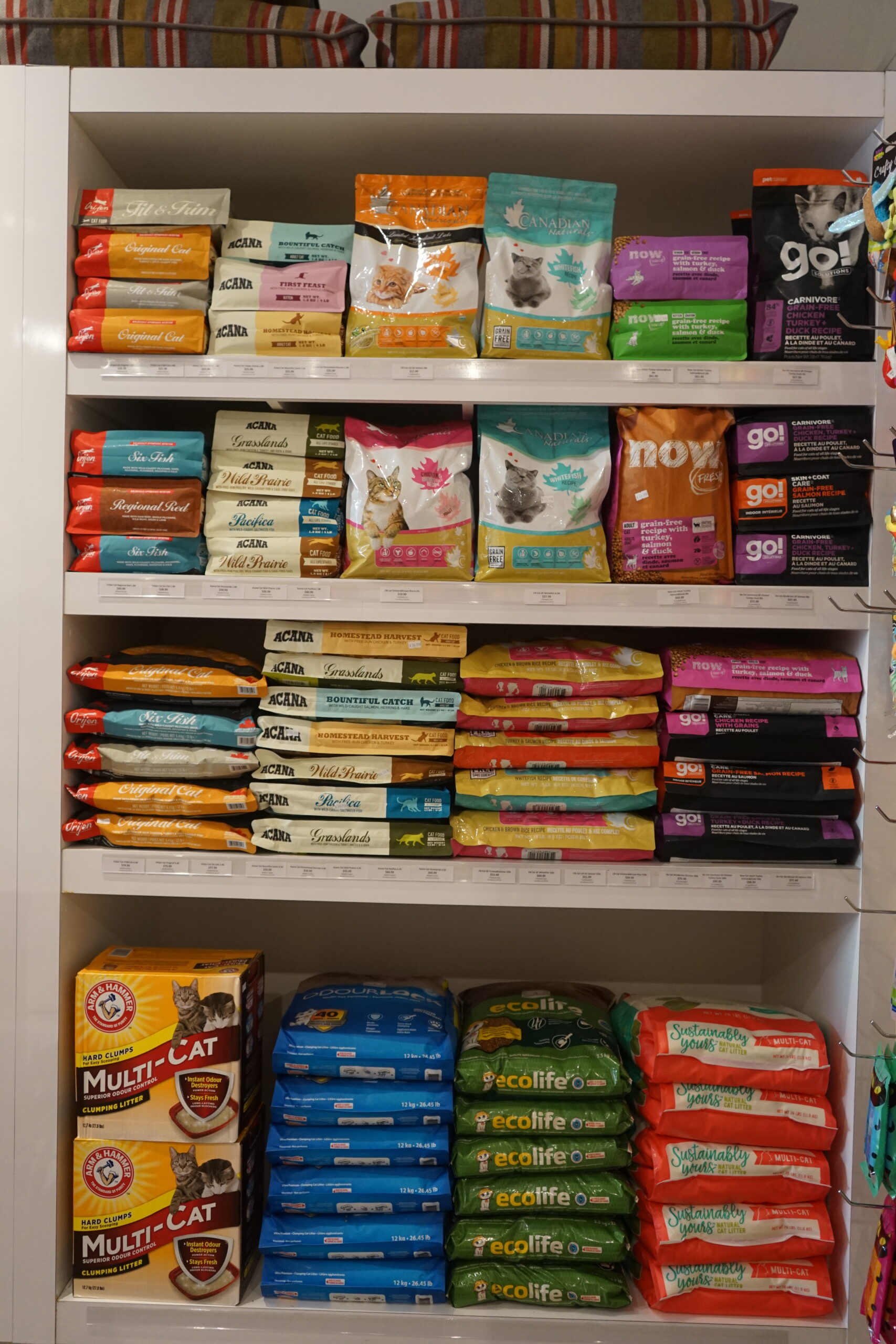 The dry food display shelfs of pet food at Bone & Biscuit Okotoks, a pet supply store in Okotoks Alberta with new owners.